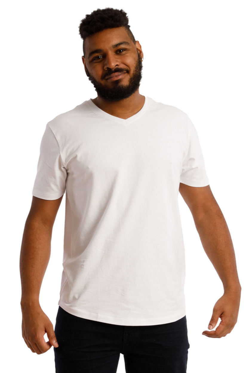 Man wearing Organic V-Neck T-Shirt from 3 Pack / Americana, showcasing its soft, stretchy fit and slightly curved hem against a plain backdrop.