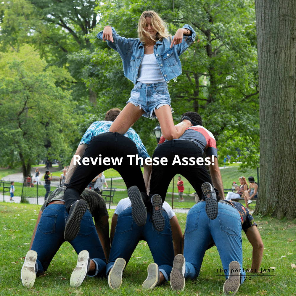 Woman on top of pyramid of men wearing The Perfect Jeans