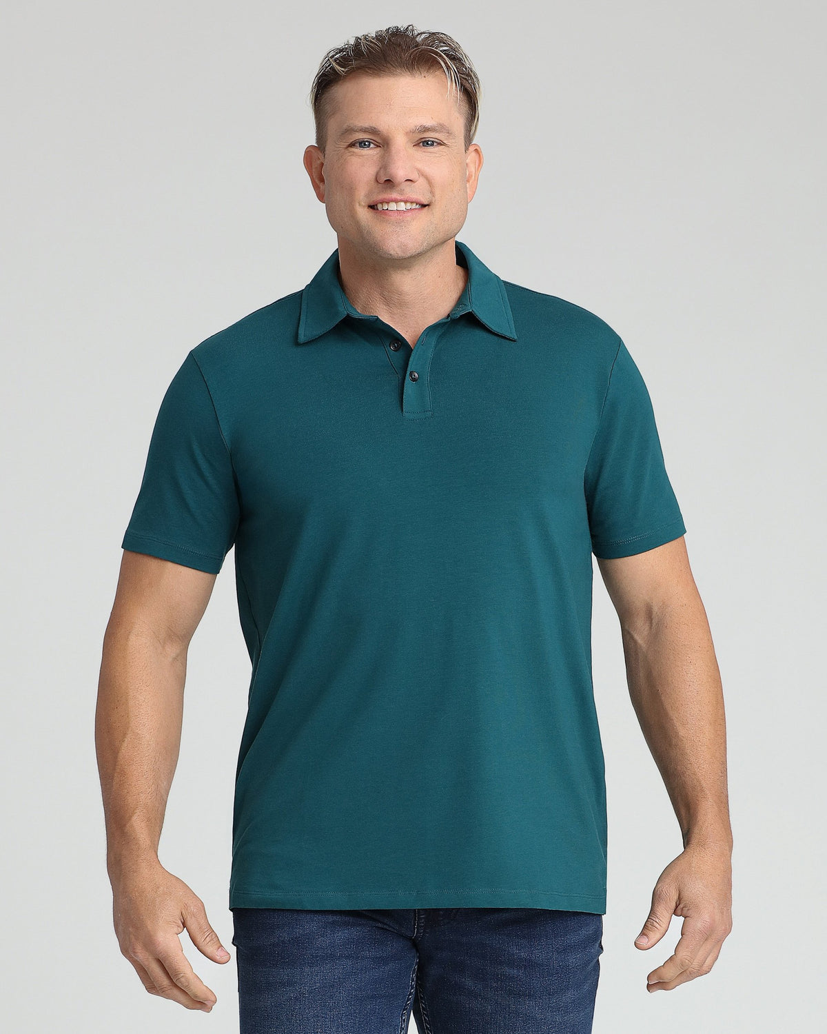 Man wearing teal short-sleeve polo shirt with collar and button placket.