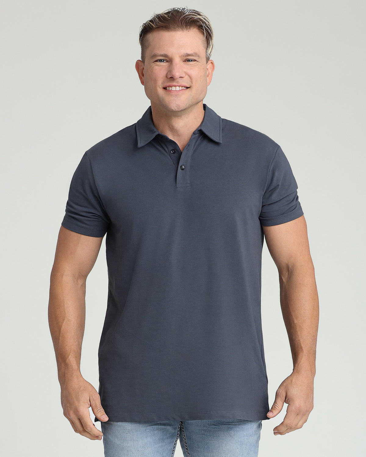 Man wearing steel gray short-sleeve polo shirt with collar and button placket.